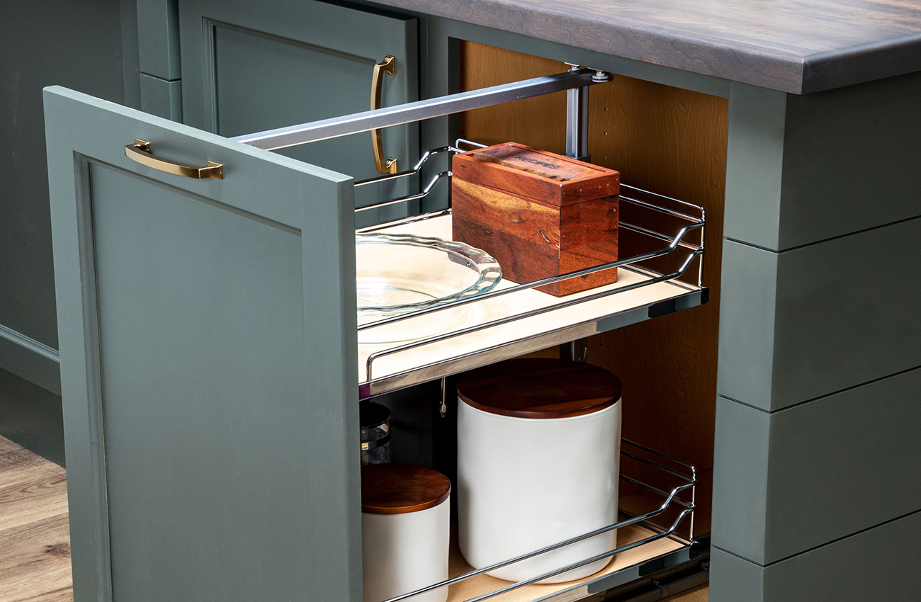 A pull-out under-the-counter storage cabinet from Bertch that features sleek, chrome rails works great for pantry & misc. kitchen storage.