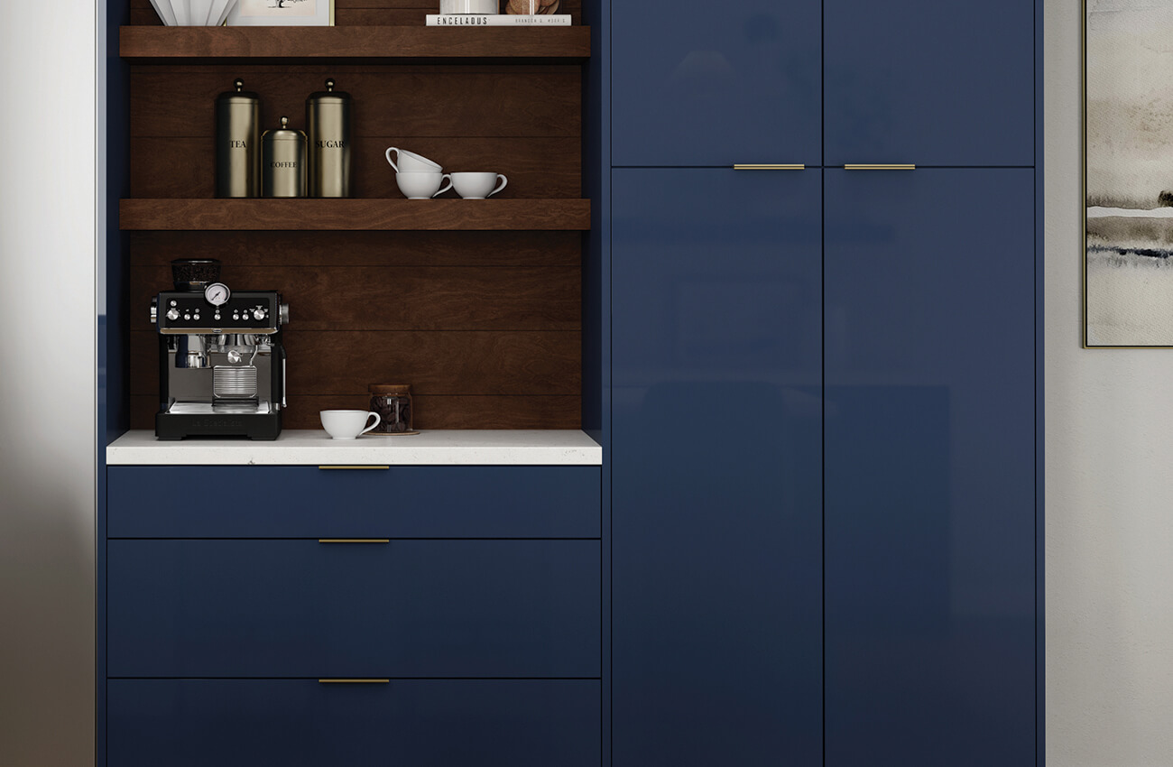 A close up of navy blue glossy acrylic cabinets with a contemporary slab cabinet door style with a contrasting beverage center in a rich, warm stained wood finish with matching floating shelves.