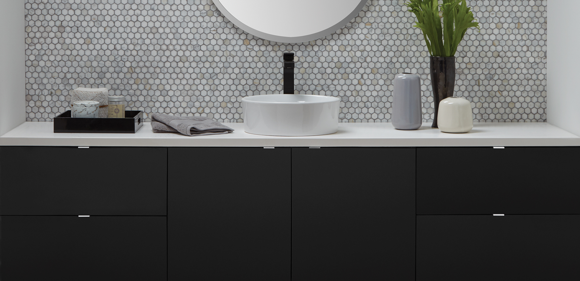 Black cabinetry is trending for bathroom vanities.