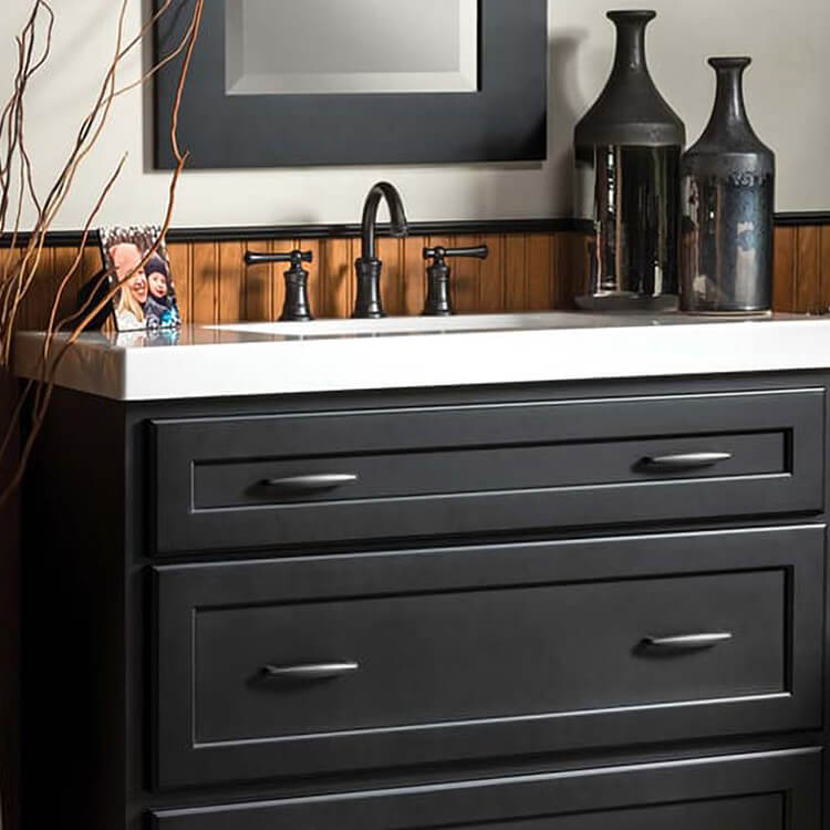 Black dresser style bathroom vanity.