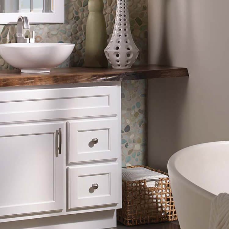 White bathroom vanity with custom wood top.