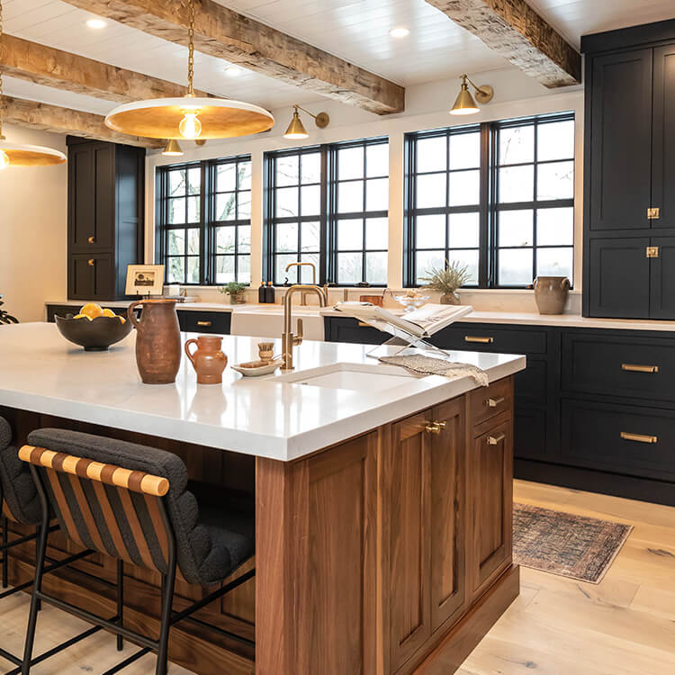 Large walnut kitchen island and deep Indigo blue perimeter cabinets