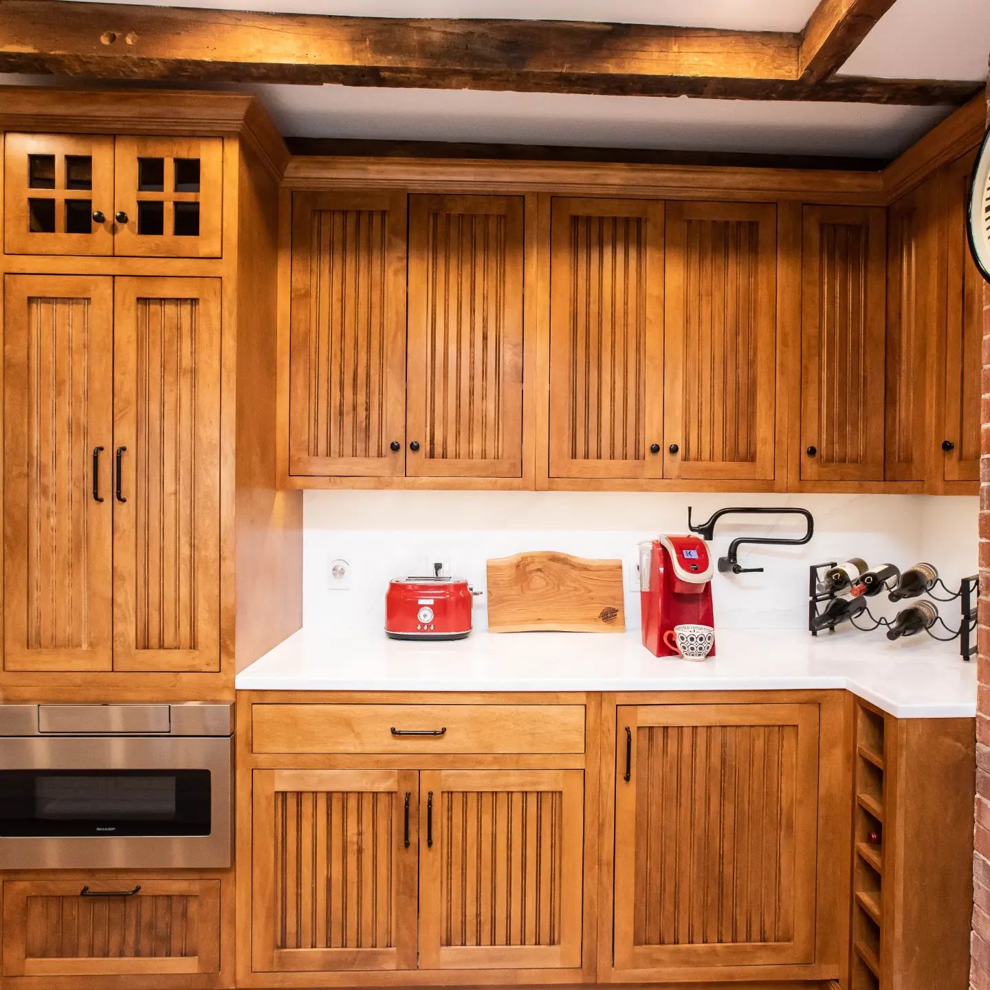 A rustic Kitchen design with beadboard shaker doors.