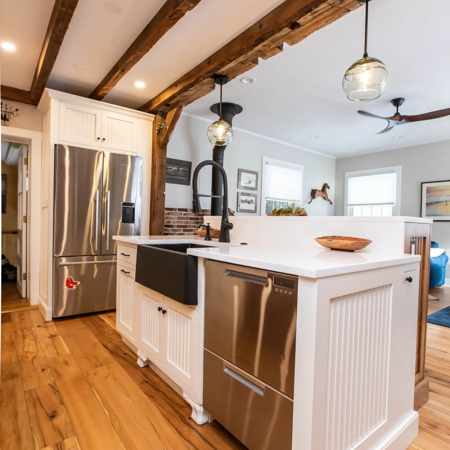 A farmhouse with a rustic styled remodel using Bertch inset cabinets.