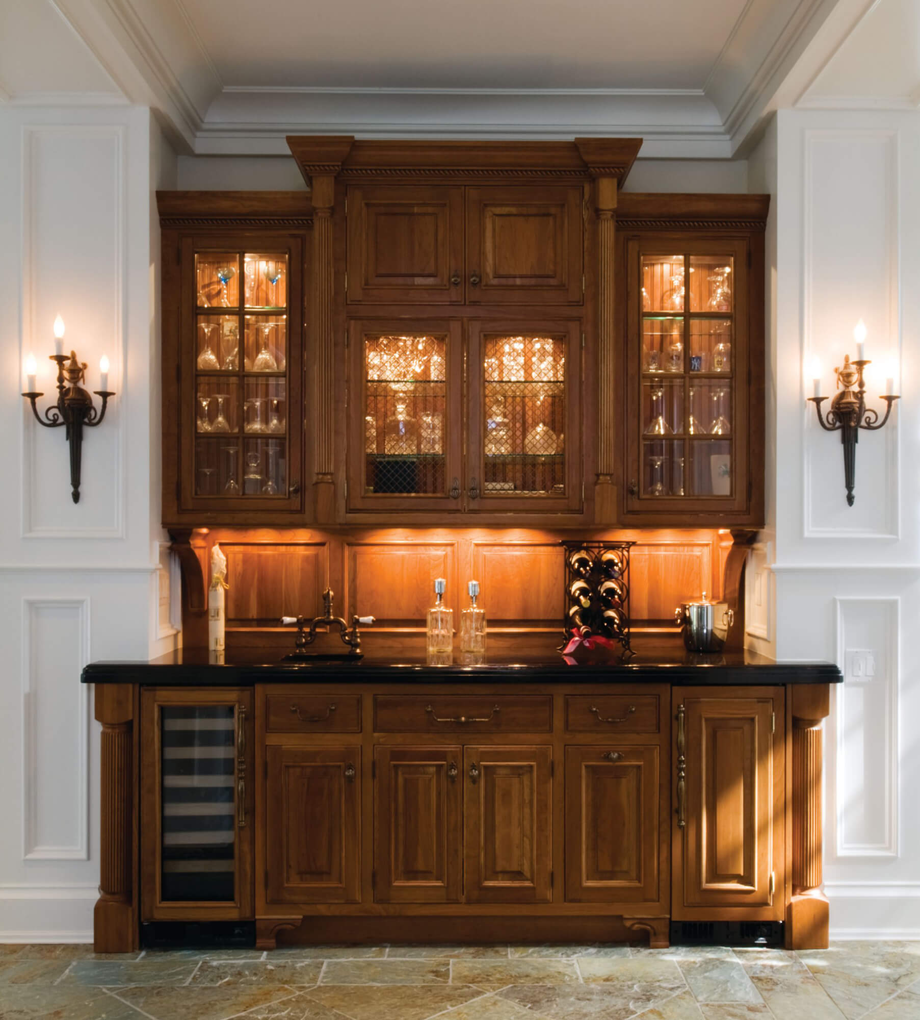 A very traditional and colonial wet bar area with lots of storage.