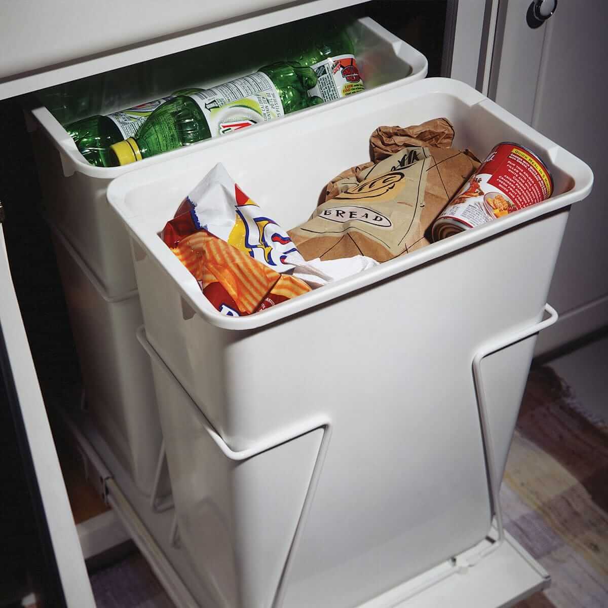 Recycling center for under counter storage in kitchens.