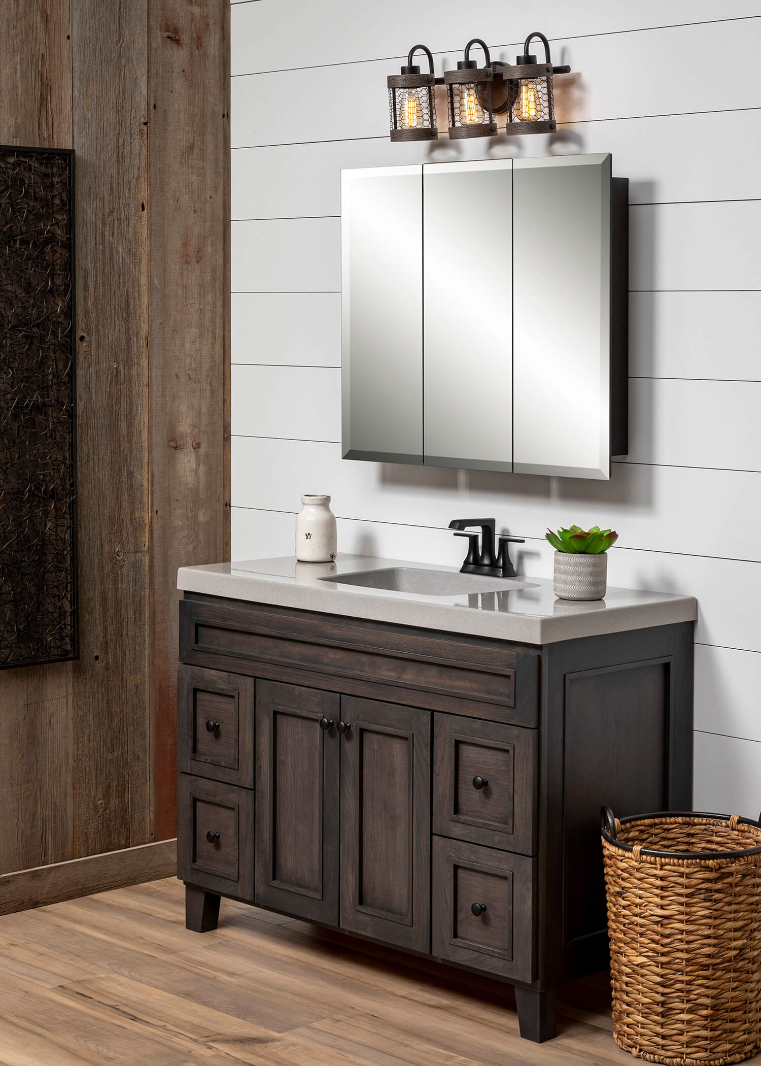 Rustic style bathroom vanity with tri-view mirror.