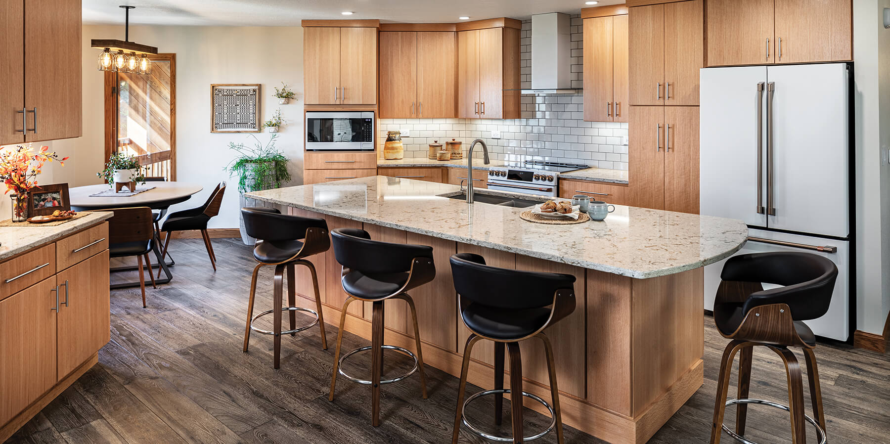 Light oak kitchen with modern slab cabinet doors and contemporary details.