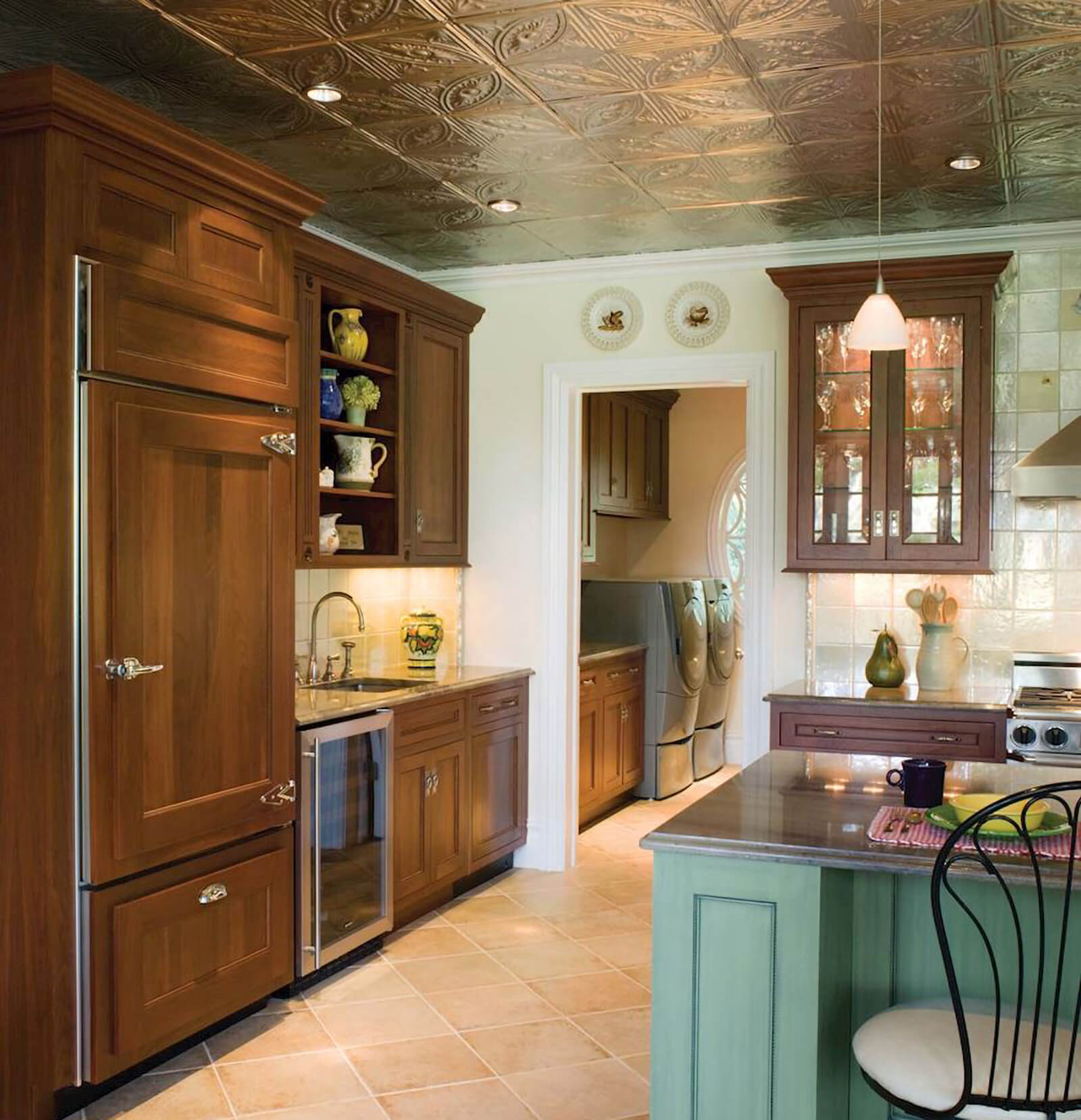 Walnut and birch kitchen with unique ceiling idea in a traditional, old-world styled kitchen design.