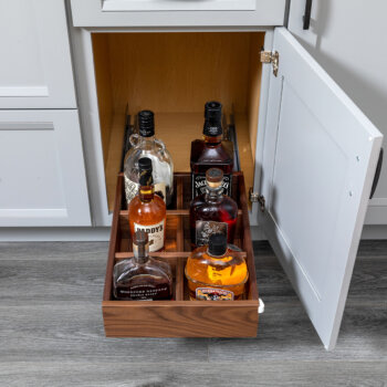 This roll-out tray with divided storage for beverage & pantry items is an ideal accessory for a beverage center, pantry, or wet bar. Shown with a Walnut Roll-Out Shelf.