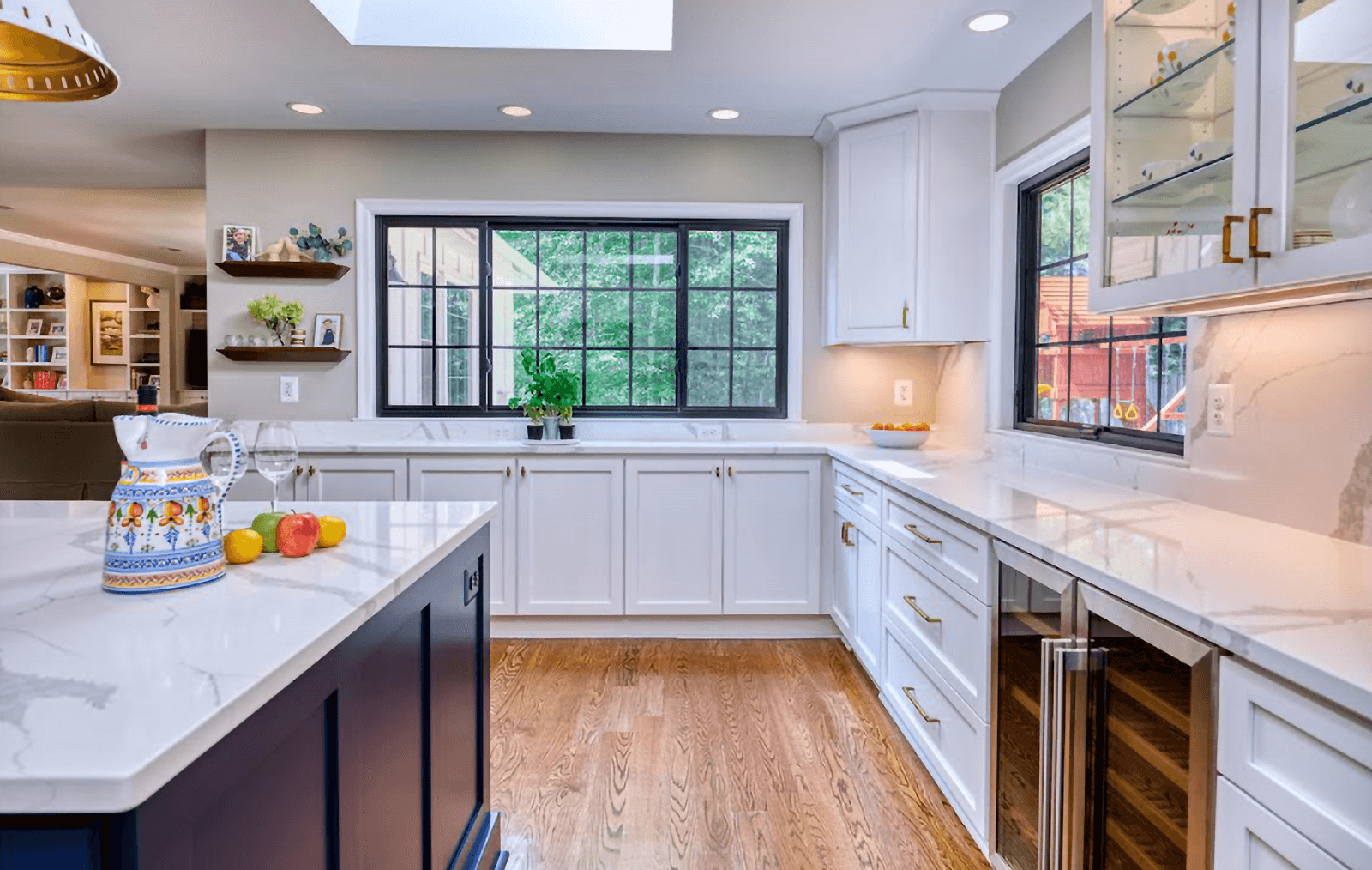 White kitchen with large blue painted kitchen island.