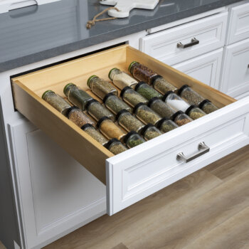 Keep your spices tucked away and easy to view in Bertch's spice rack drawer cabinet accessory near your food prep zone.