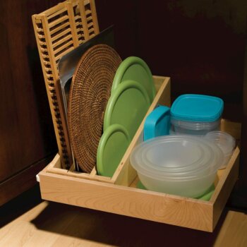 Store serving trays, cutting boards, platters, lids, mixing bowls, and lids all in one accessible and organized roll-out tray.