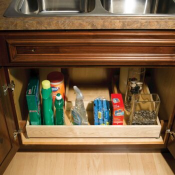 This under-the-sink roll-out shelf is specialized to maximize the storage space beneath sinks while accommodating the plumbing fixtures.