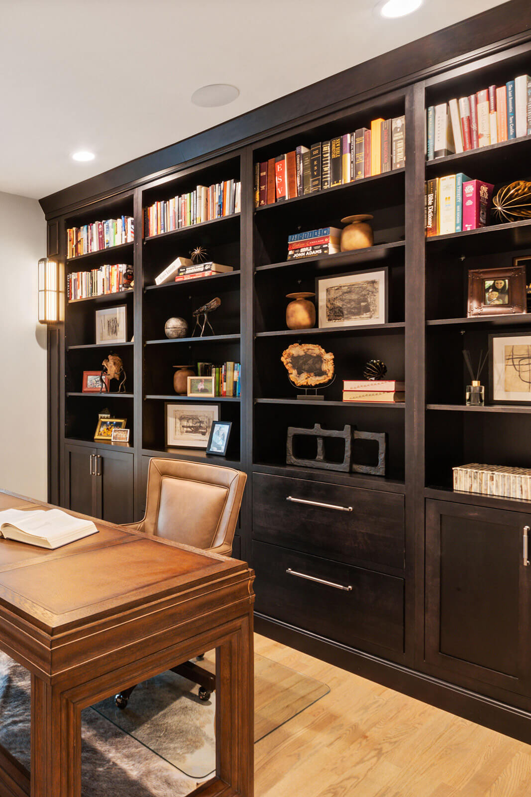 Gorgeous Bertch home office cabinetry, bookshelves shown in Quincy Inset style,