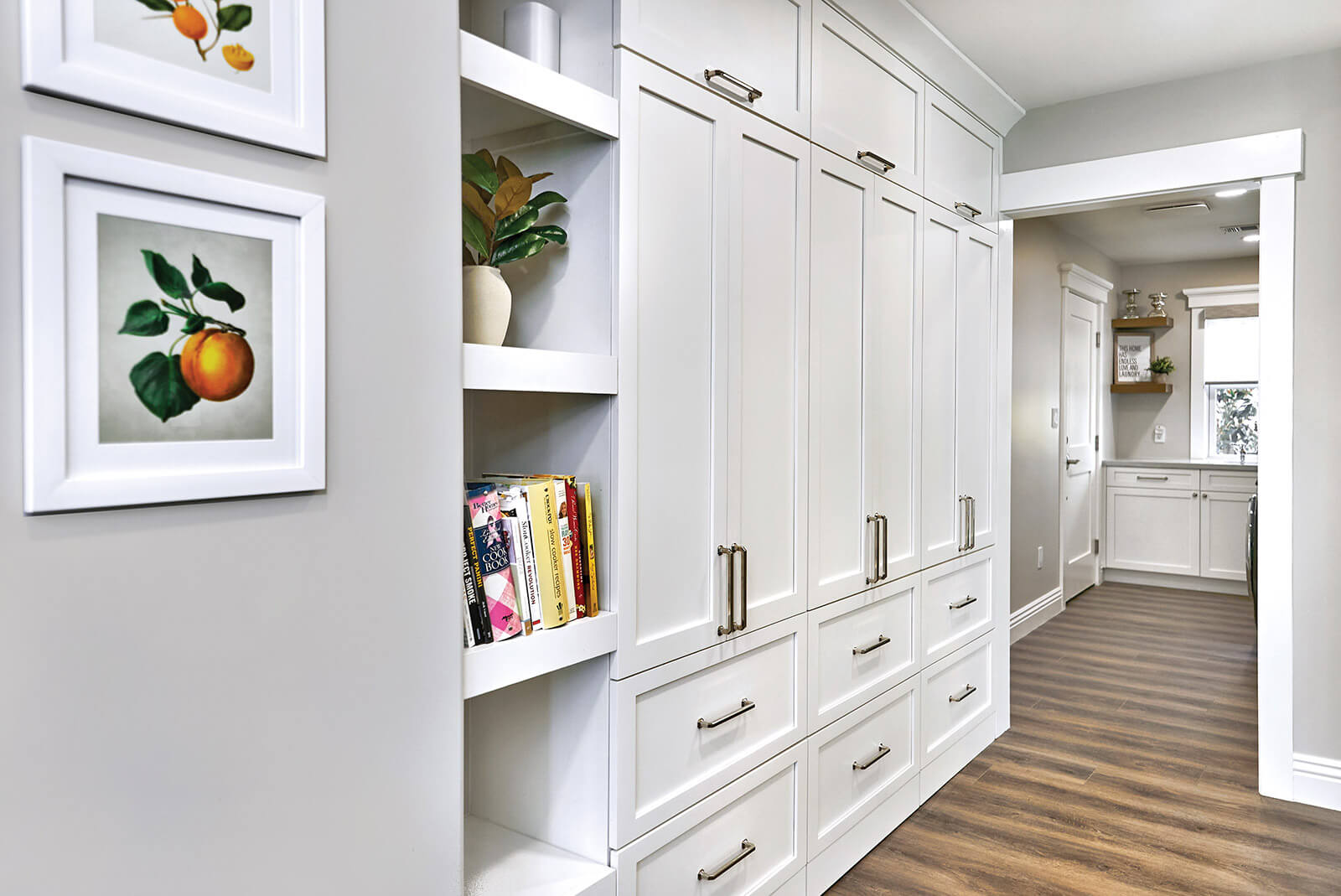 Bertch White shaker style cabinets in a wall closet configuration, shown in Lexington door style.